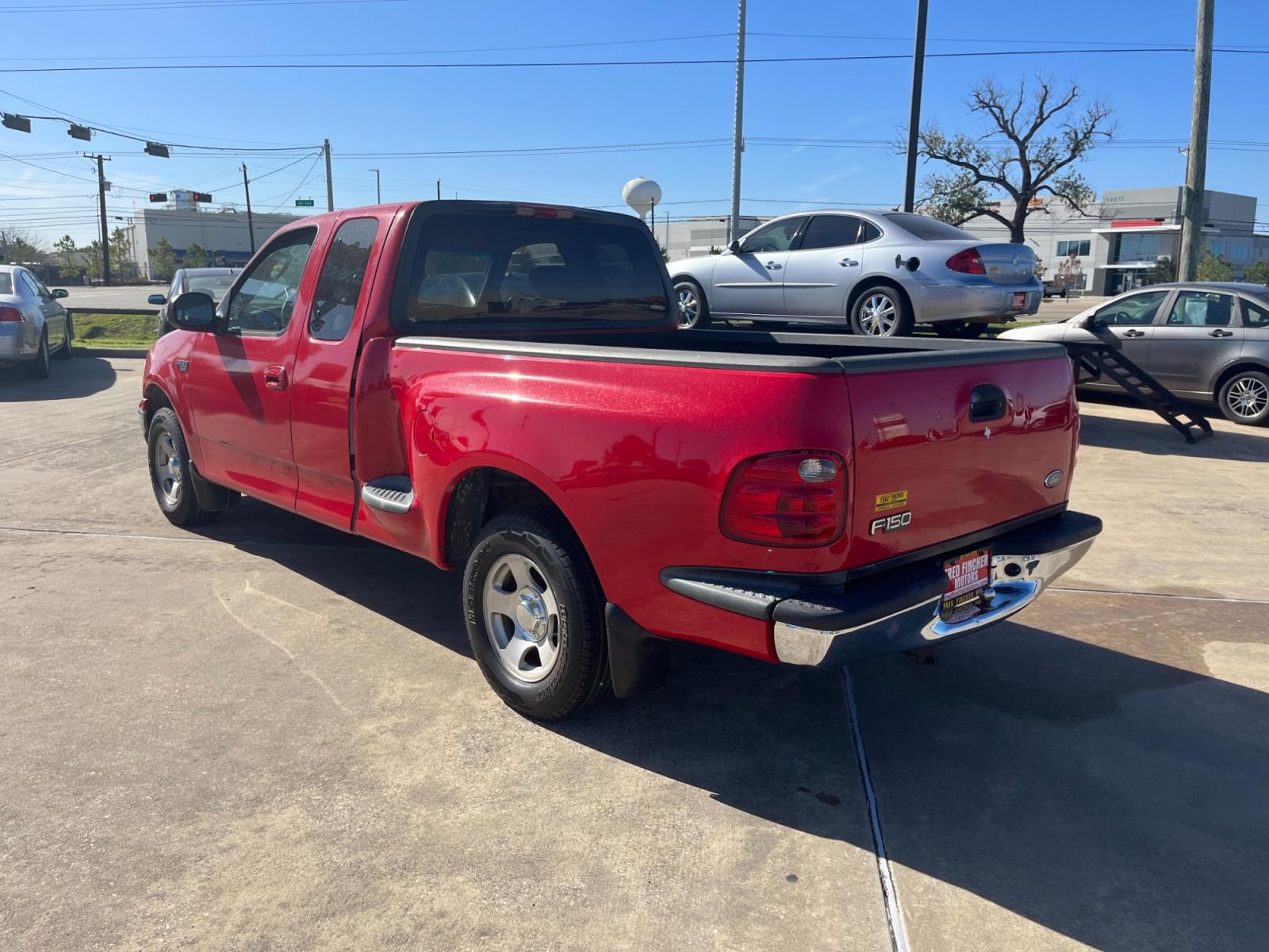 2003 red /TAN Ford F-150 XL SuperCab Flareside 2WD (1FTRX07213K) with an 4.2L V6 OHV 12V engine, Automatic transmission, located at 14700 Tomball Parkway 249, Houston, TX, 77086, (281) 444-2200, 29.928619, -95.504074 - Photo #4